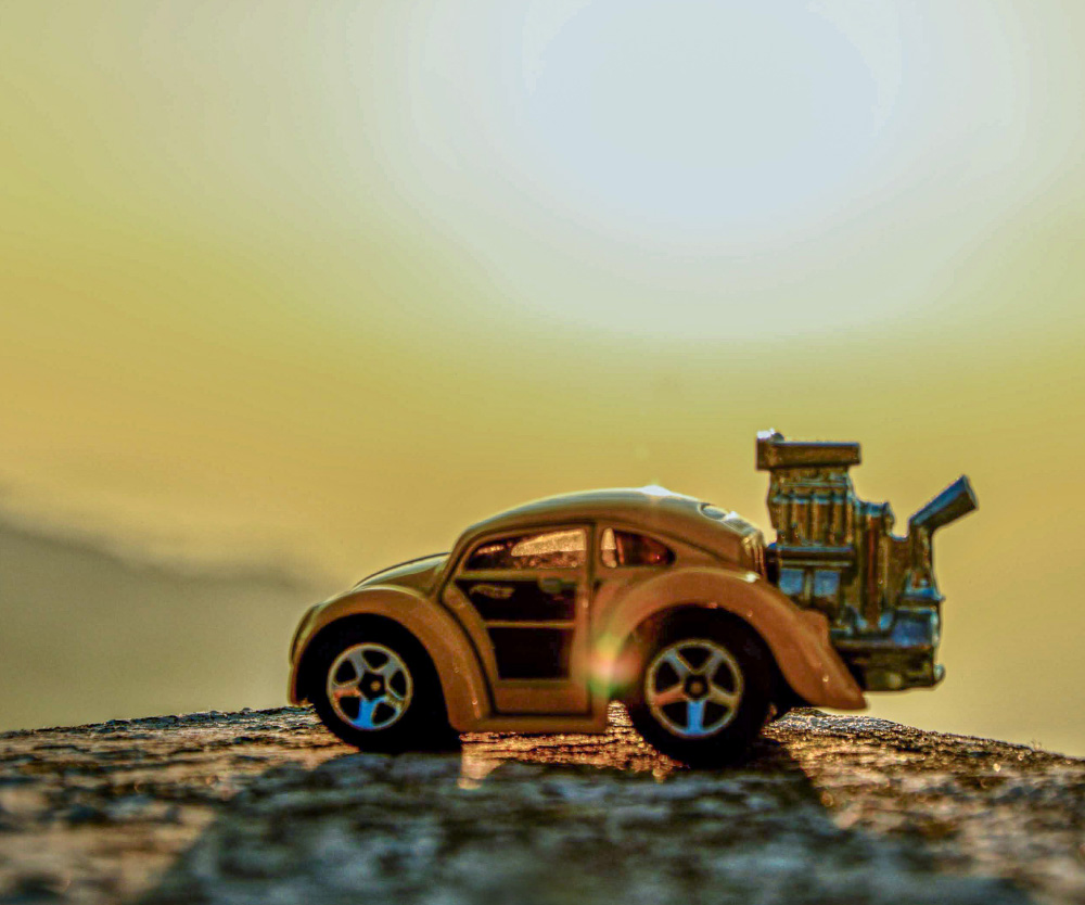 a toy car on a rock