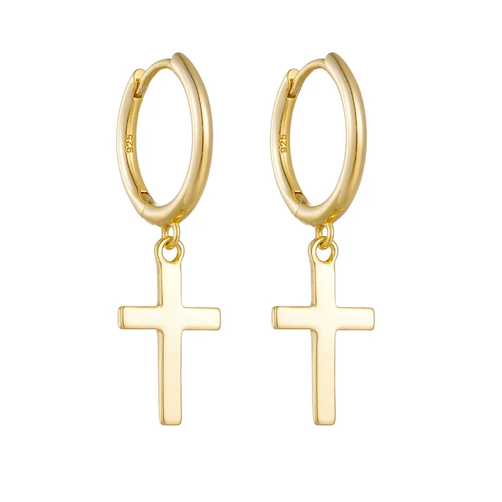a pair of gold earrings with cross from them