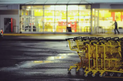 a group of shopping carts in a parking lot