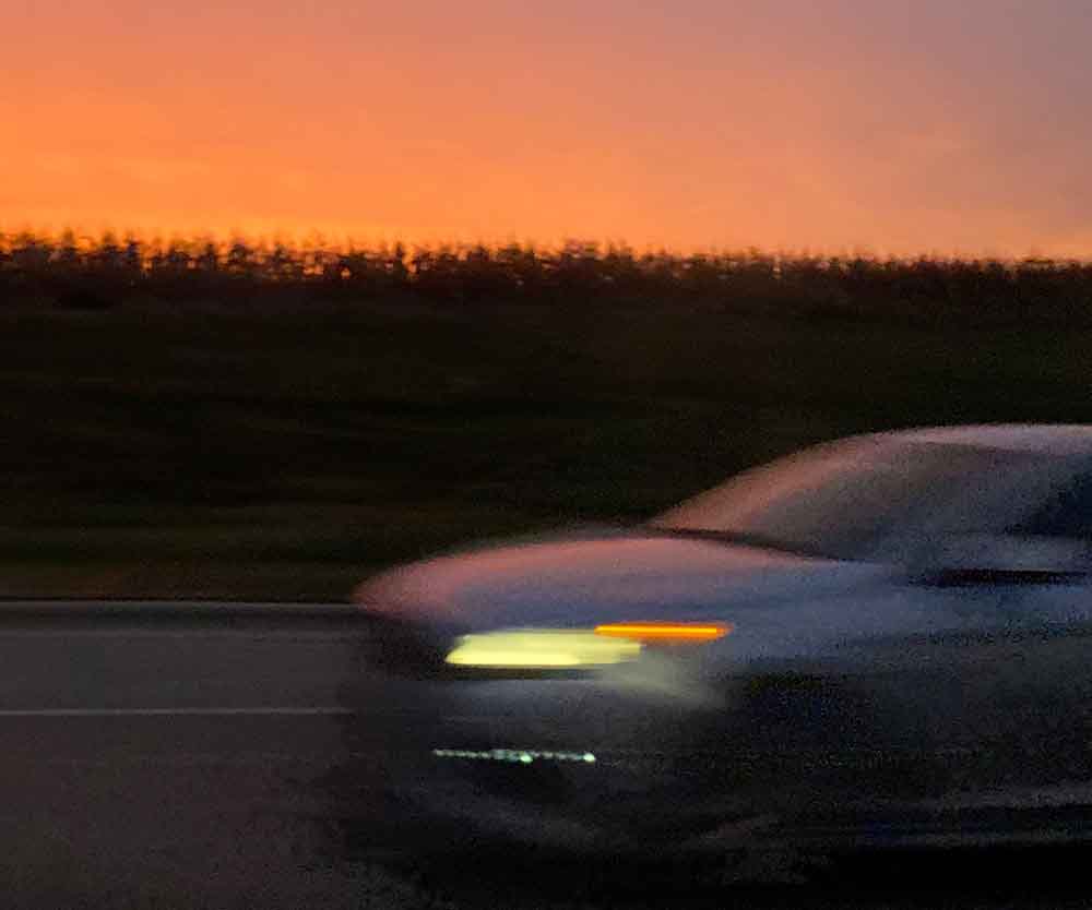 a blurry car on the road