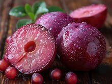 a group of plums cut in half