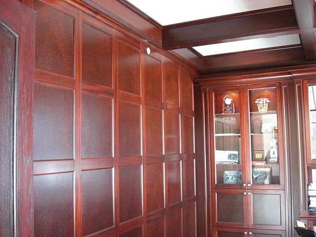 a room with wood paneled walls