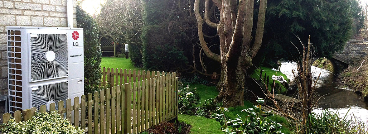 a fence and a tree in a yard