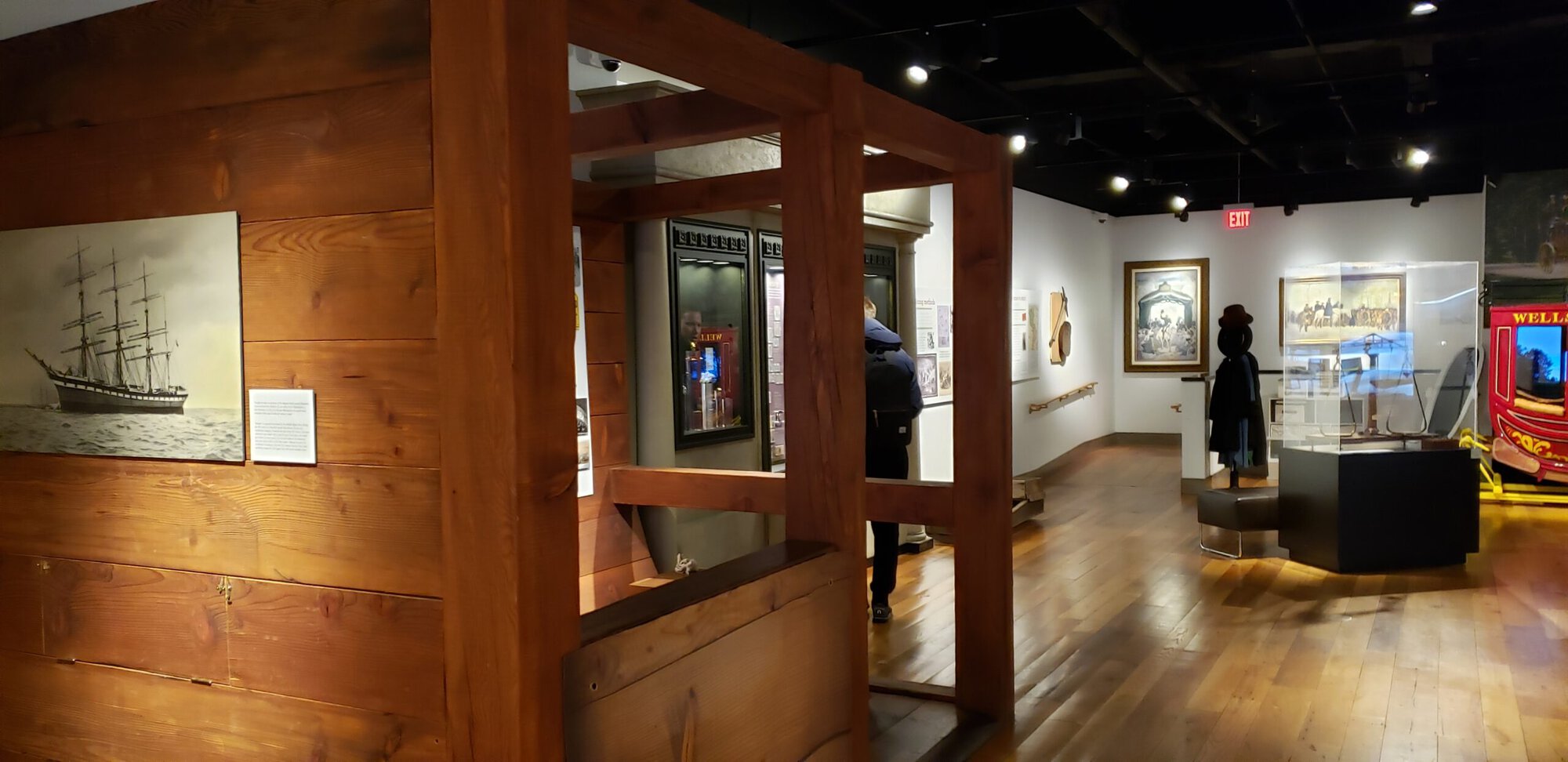 a wooden structure with a person standing in front of it