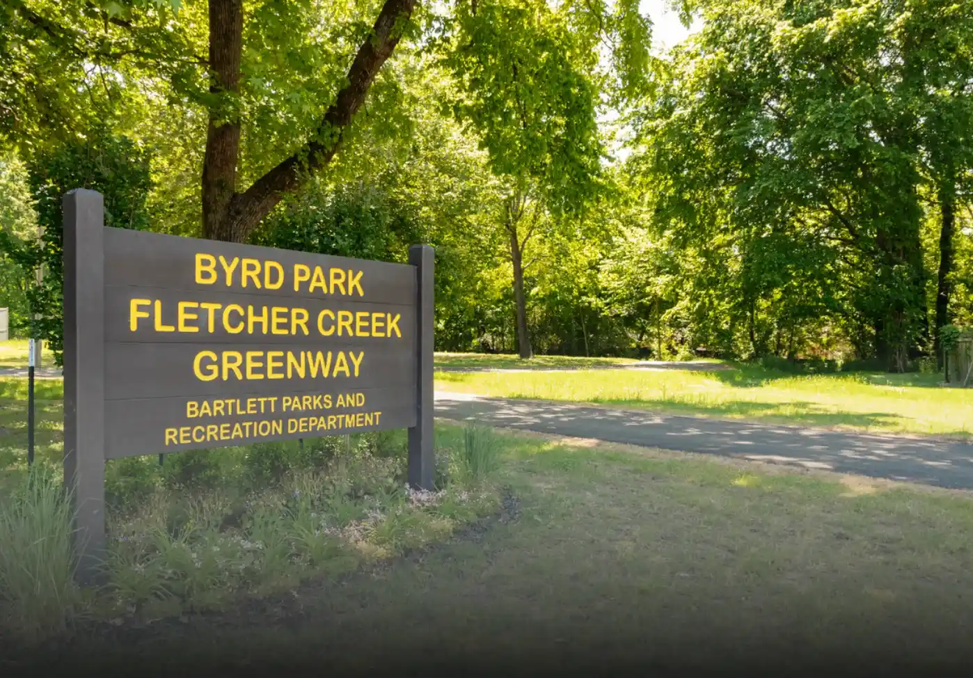 a sign in a park