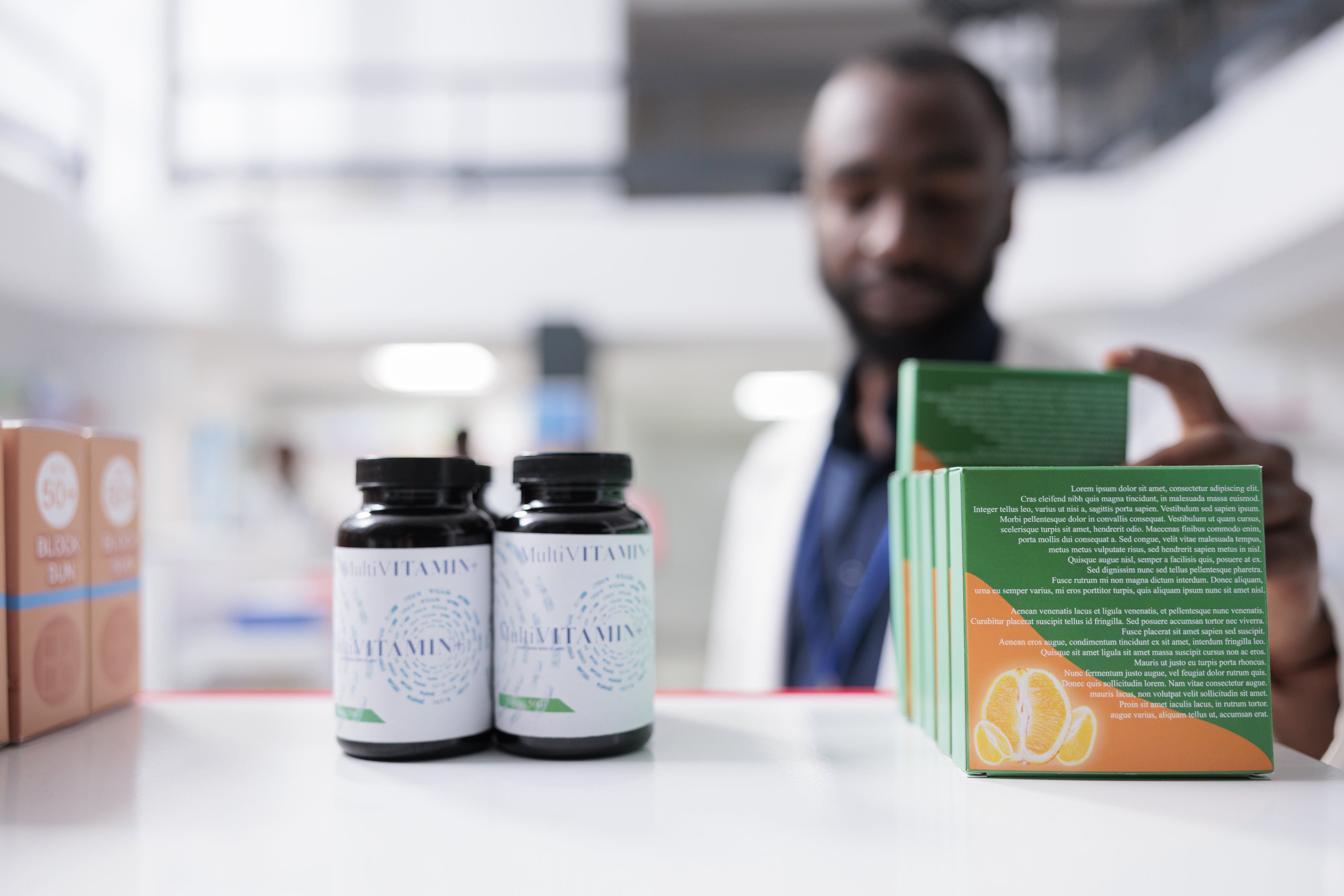 a man holding a bottle of vitamins