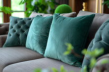 a couch with green pillows