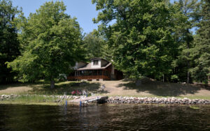 a house on the shore of a lake