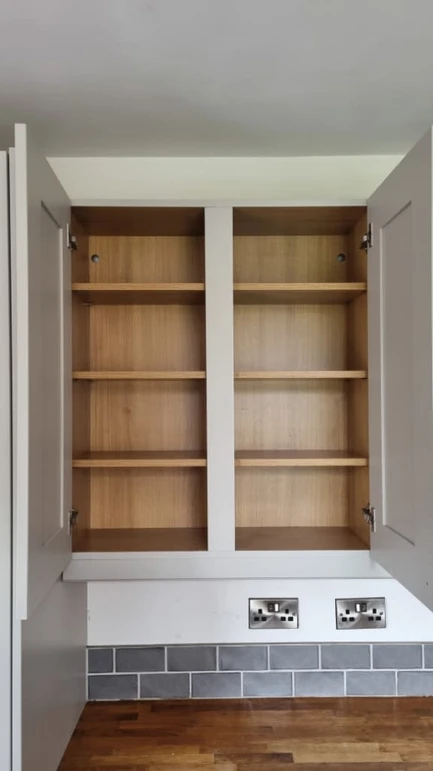 a shelf in a cabinet