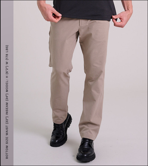 a man wearing khaki pants and black shoes