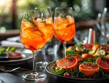 a plate of oranges and a drink