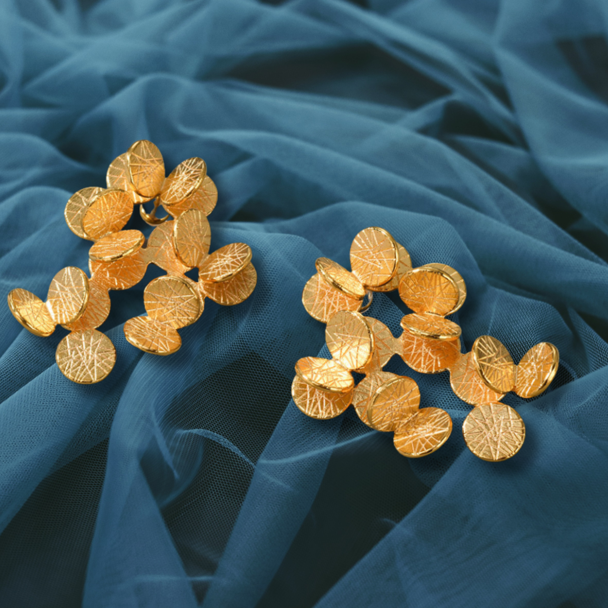 gold coins on a blue fabric