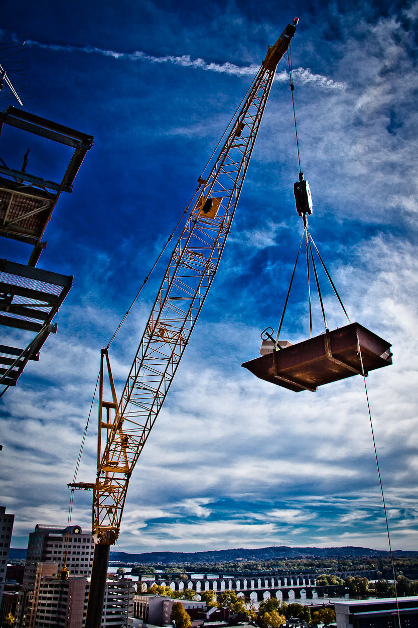 a crane lifting a container