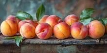 a group of peaches with leaves