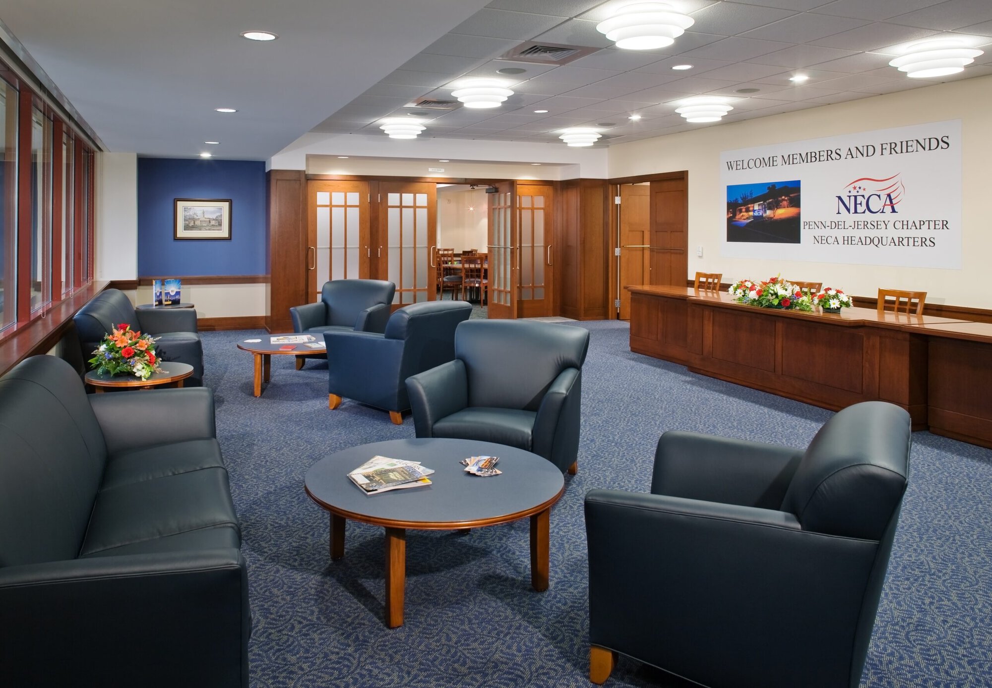 a room with blue chairs and tables