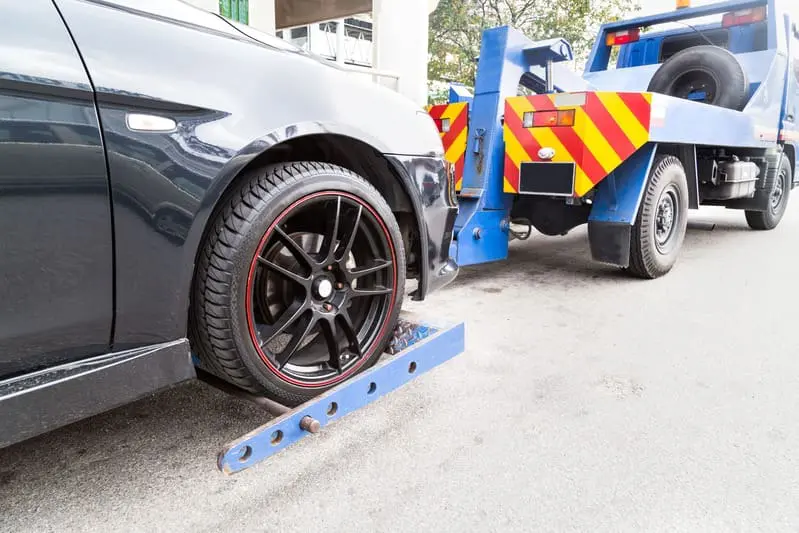 a car towing a tow truck