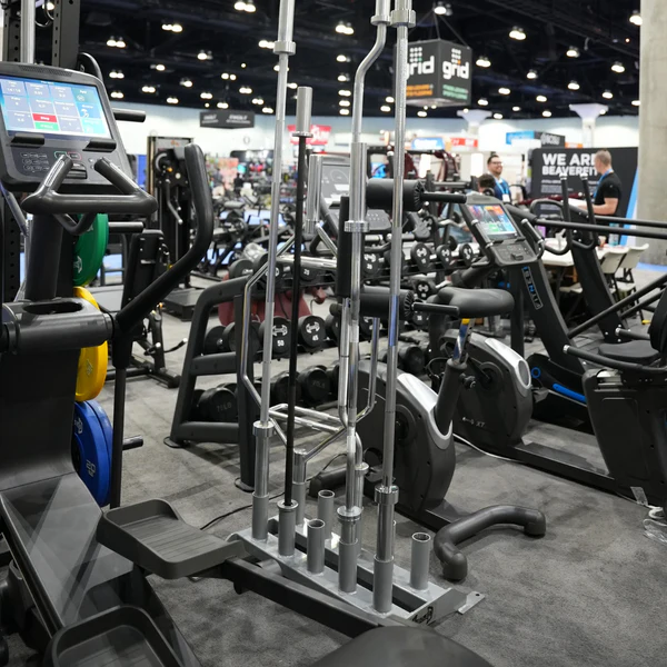 a group of exercise machines in a gym