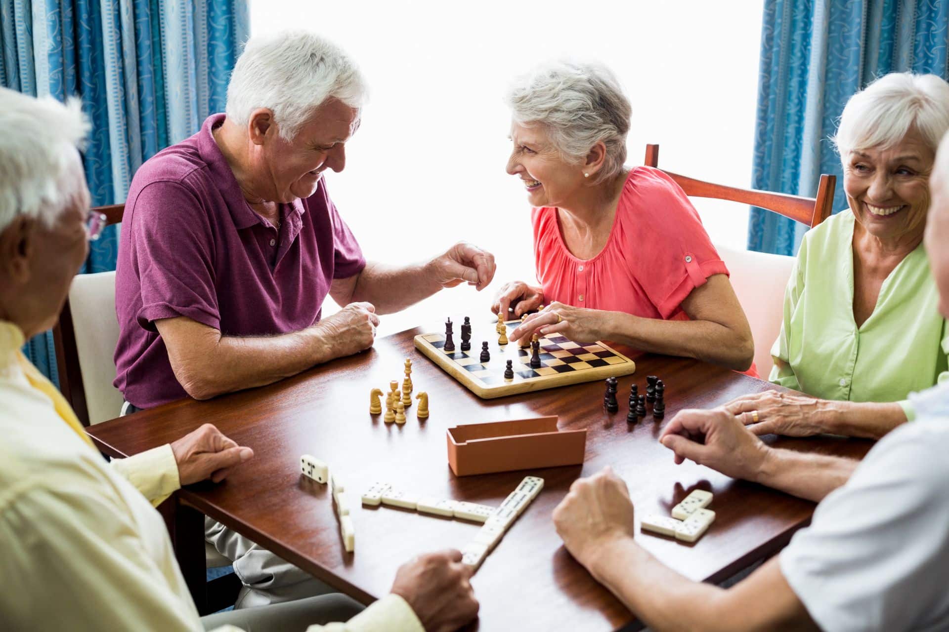 a group of people playing chess