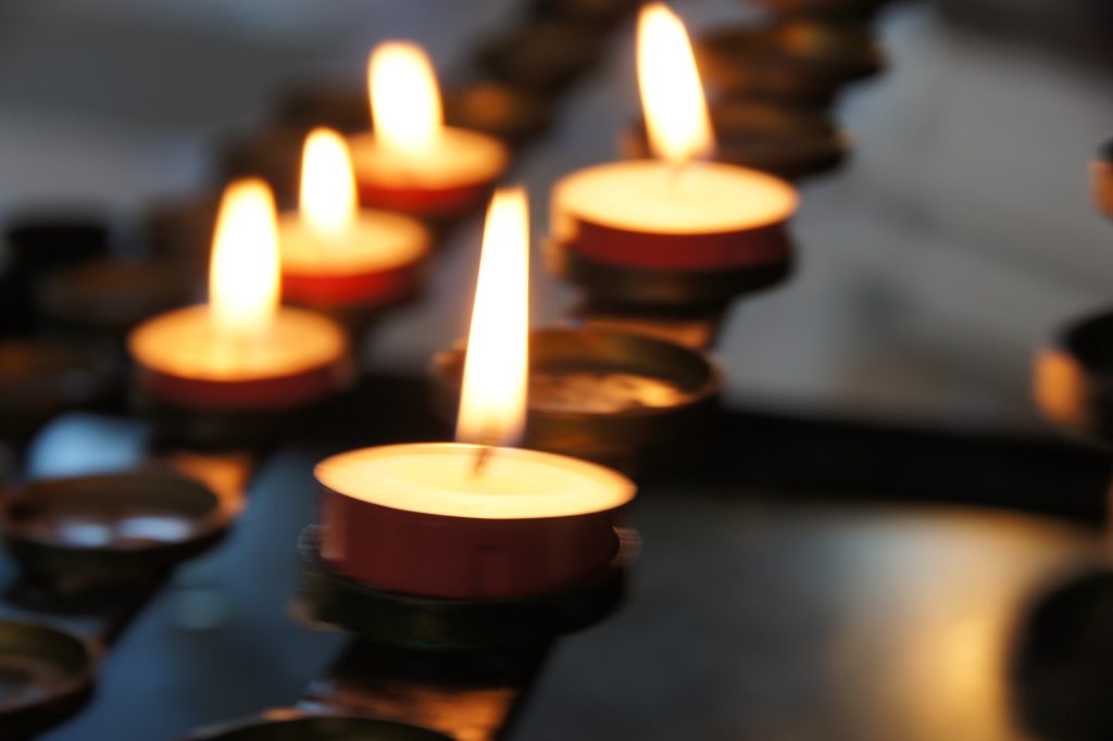 a row of lit candles