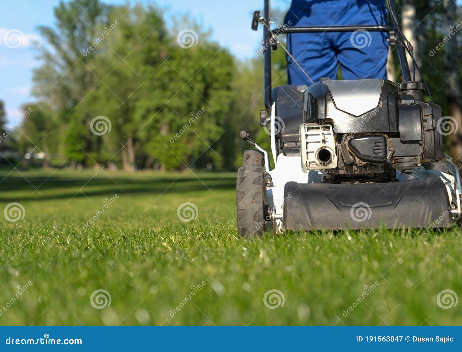 a person mowing the grass