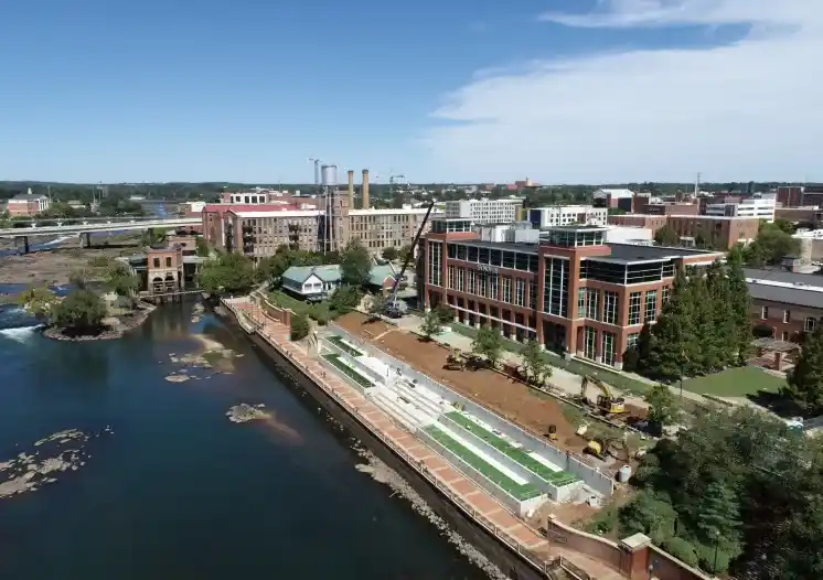 a river with buildings and a body of water