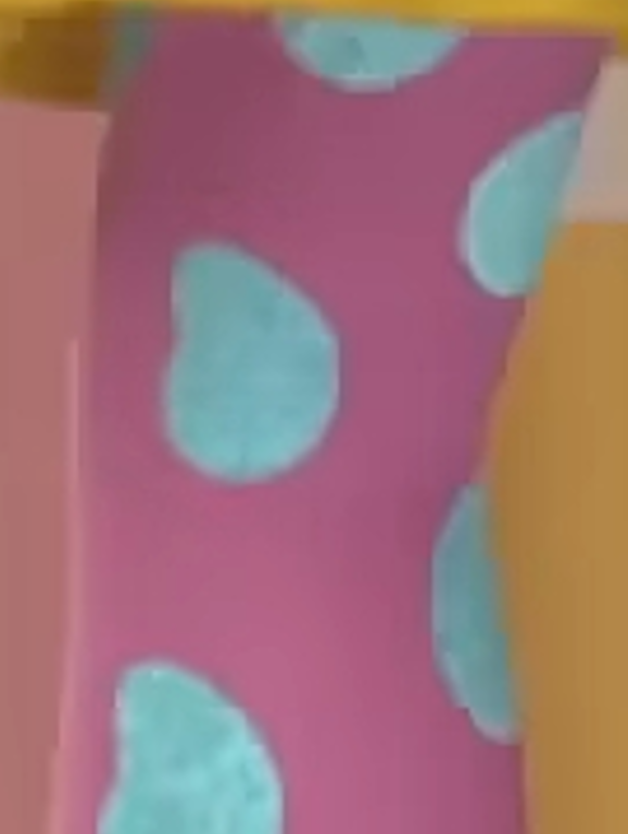 a person wearing pink and blue polka dot stockings