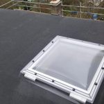 a clear square window on a roof