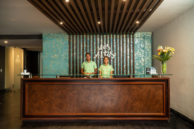 two men standing behind a counter