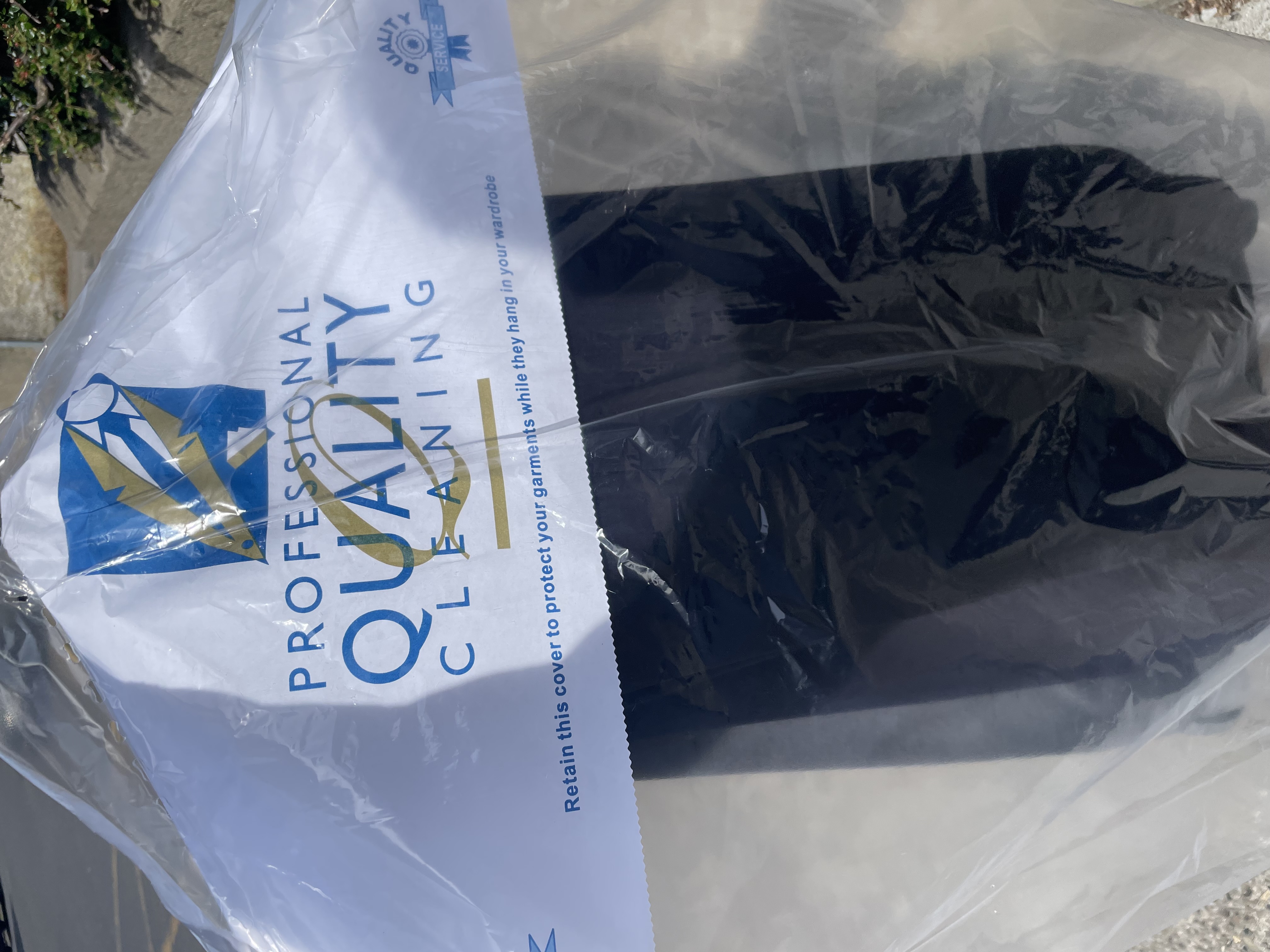 a plastic bag with a black object in it