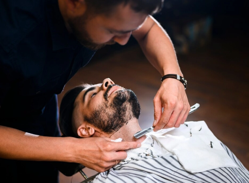 a man shaving a beard