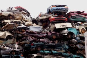 a pile of cars stacked in a pile