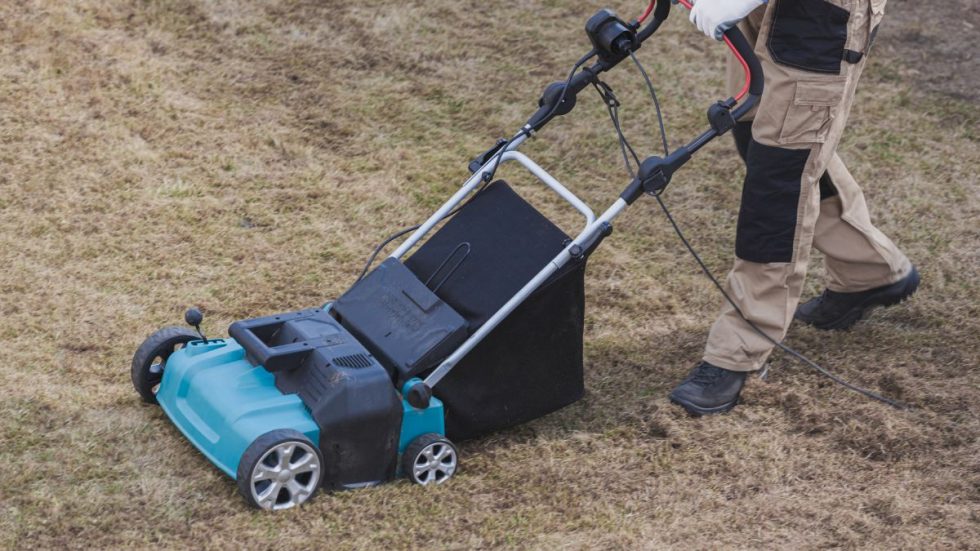 a person using a lawnmower
