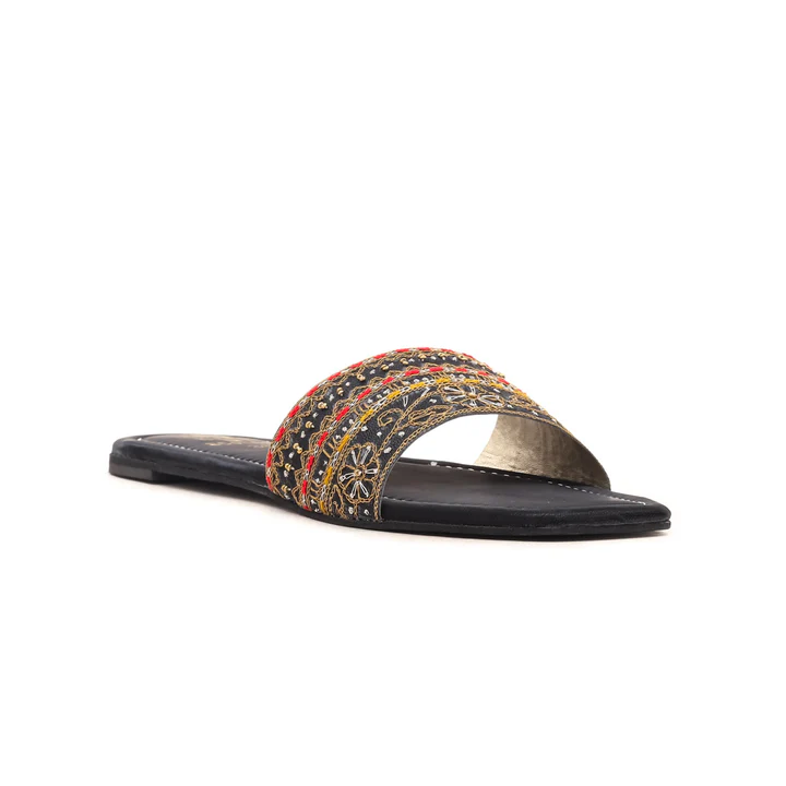 a black and yellow sandal with a colorful design
