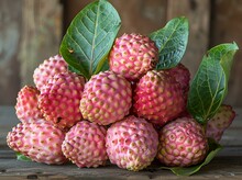 a pile of fruit with leaves