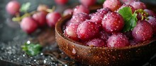 a bowl of grapes on a table