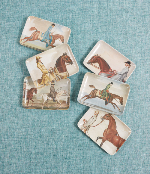 a group of plates with horses and riders on them