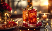 a two glasses of ice tea with berries on a plate