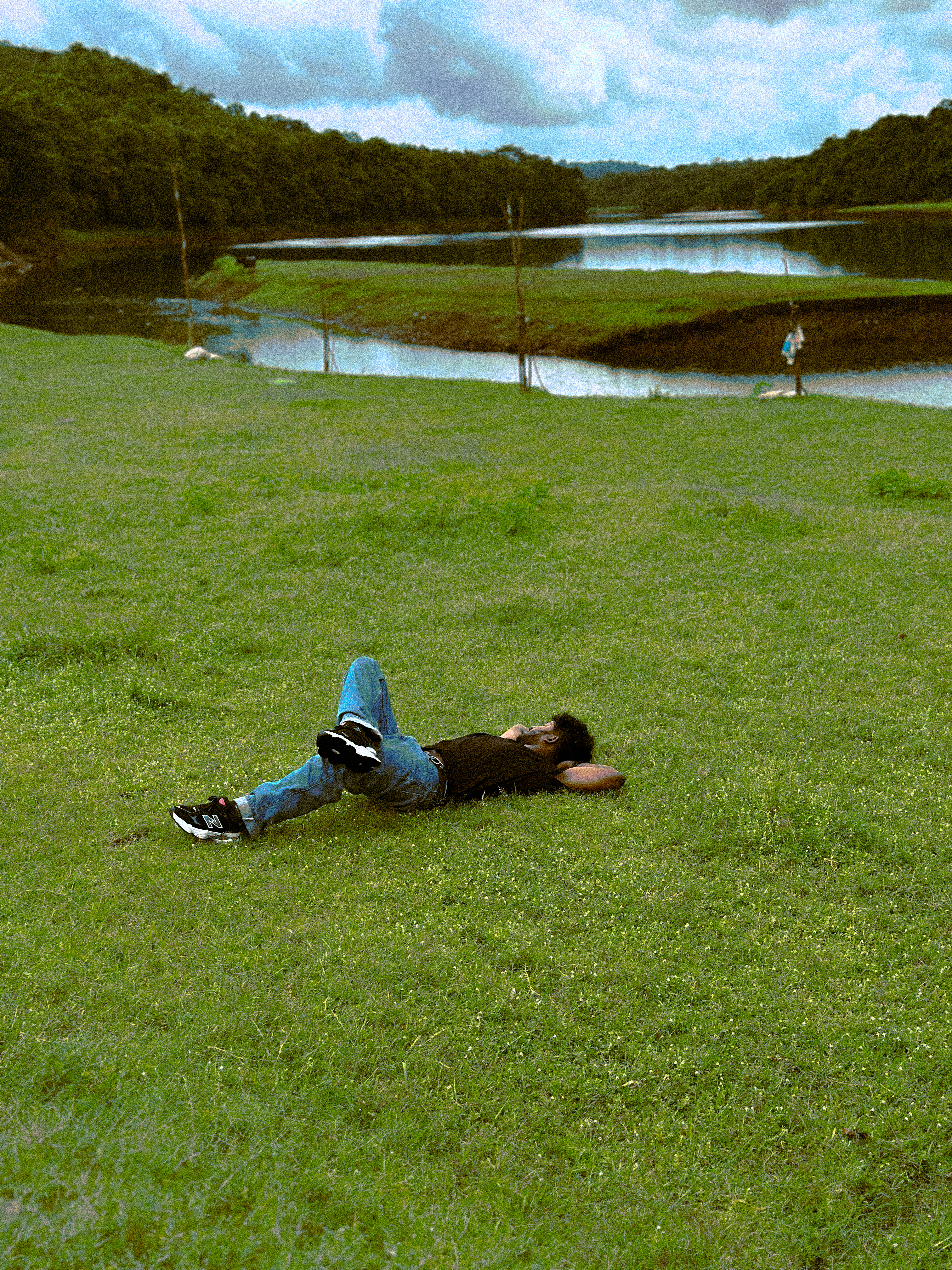 a man lying on grass