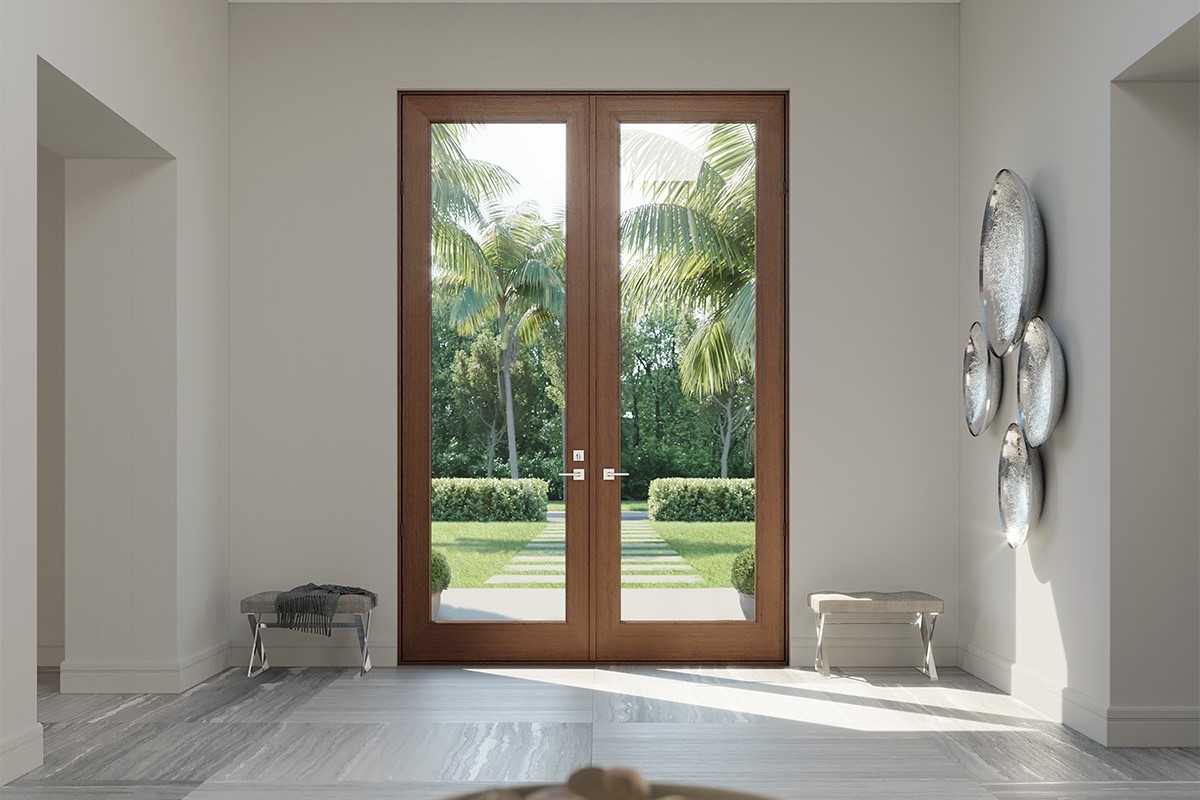 a door with glass doors and a view of the garden