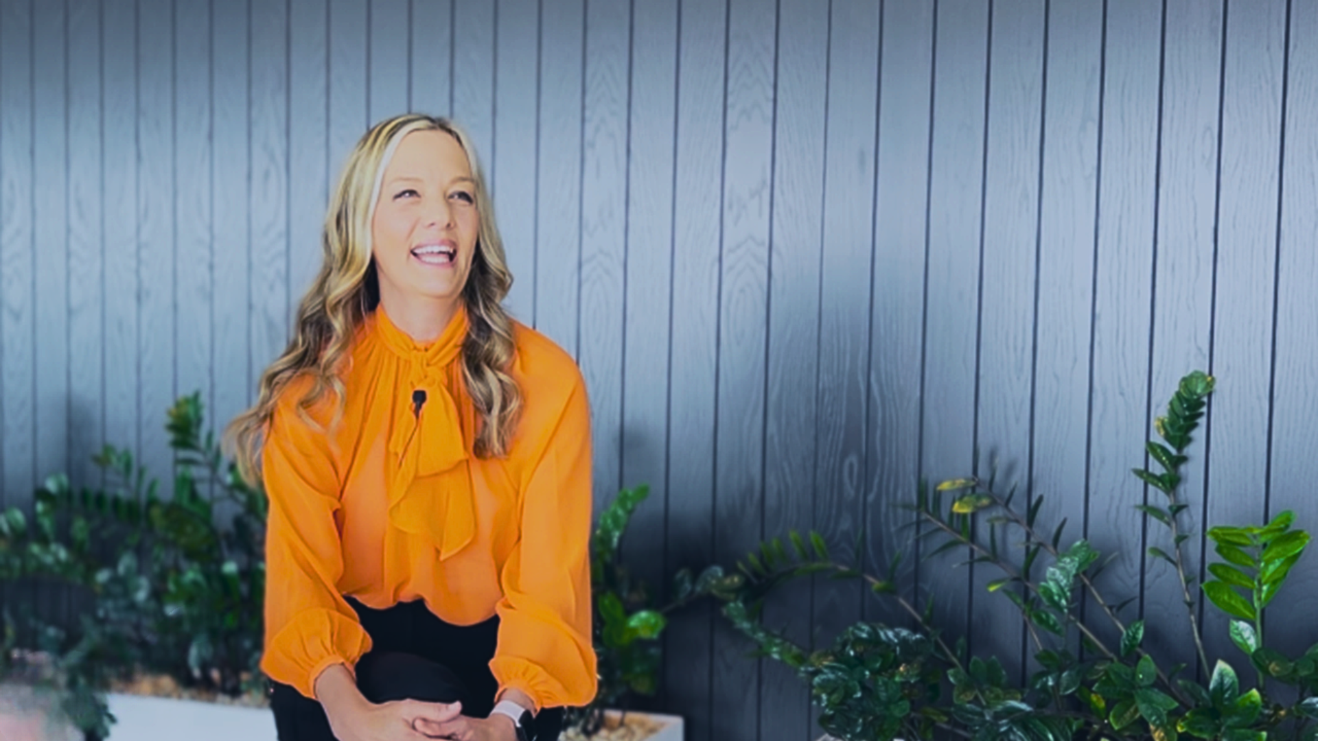 a woman in an orange shirt