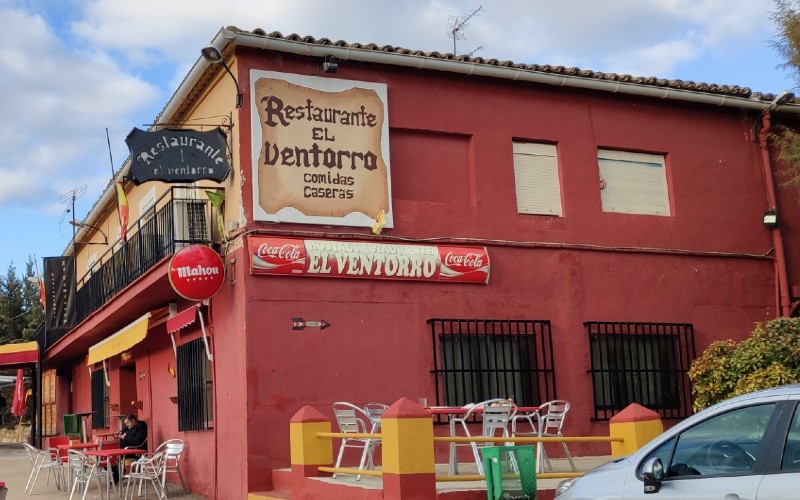 a red building with signs on the side