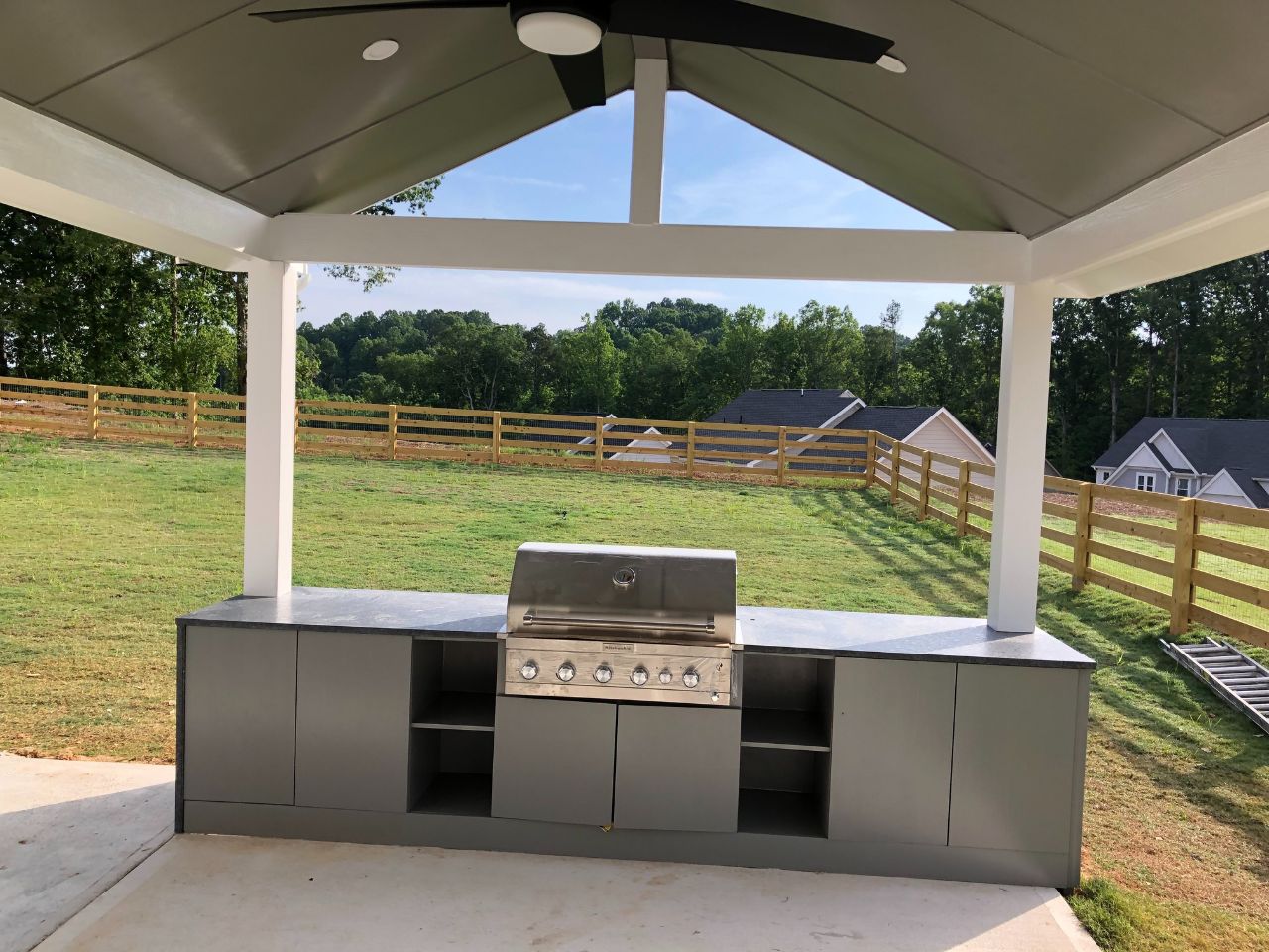 a grill under a covered patio