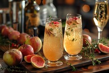 two glasses of liquid with fruit on a wooden board