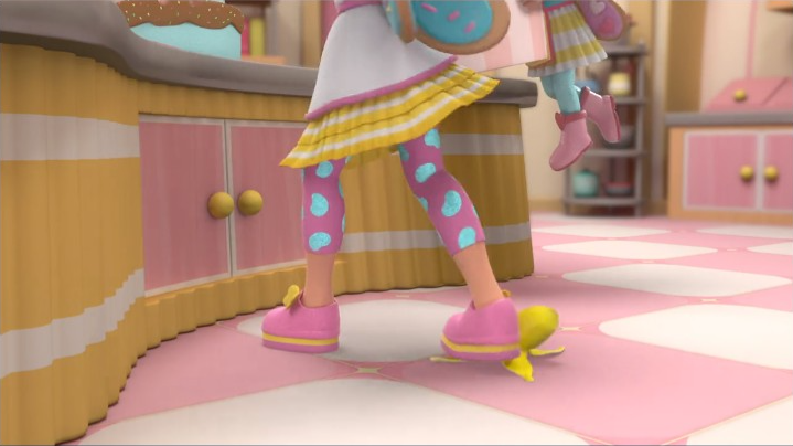 cartoon character legs in pink and yellow polka dot pants and pink shoes