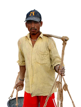 a man holding a rope on his shoulder