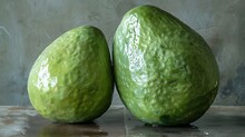 two avocados on a table