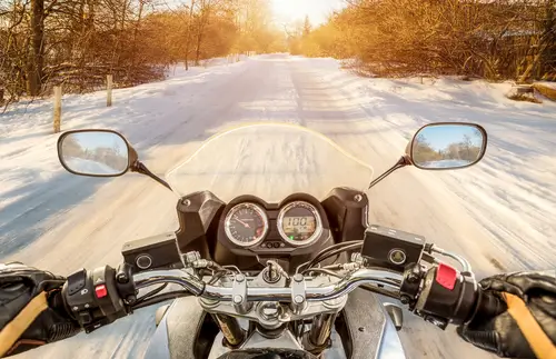 a motorcycle on a snowy road