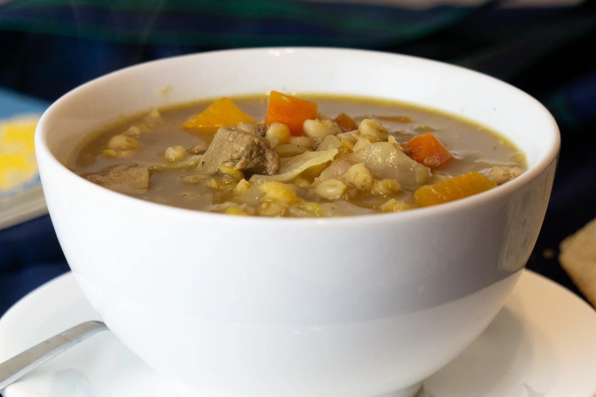 a bowl of soup with meat and vegetables