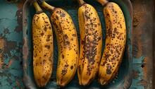 a group of bananas in a blue tray