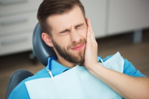 a man in a dentist chair